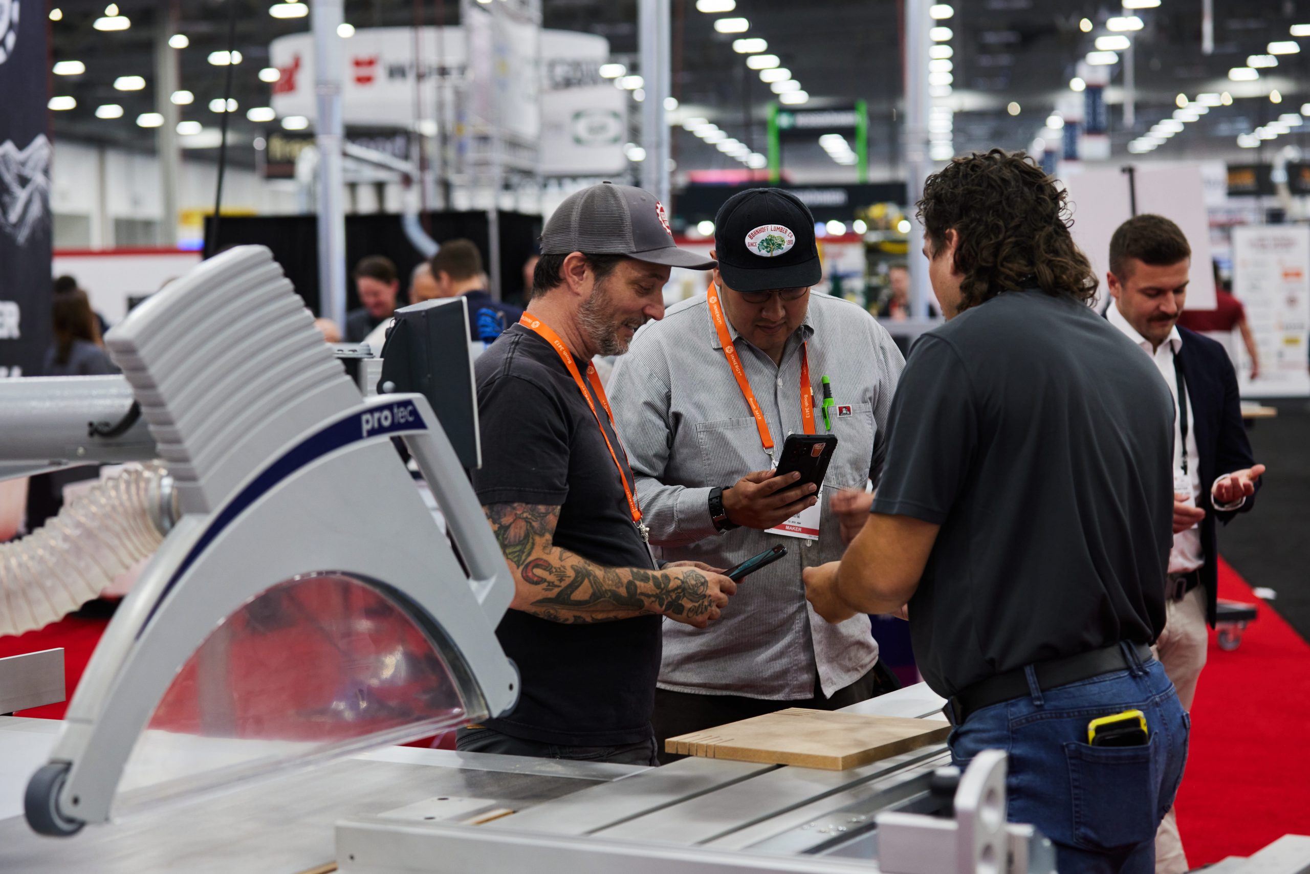 exhibitors with attendees in booth at AWFS Fair